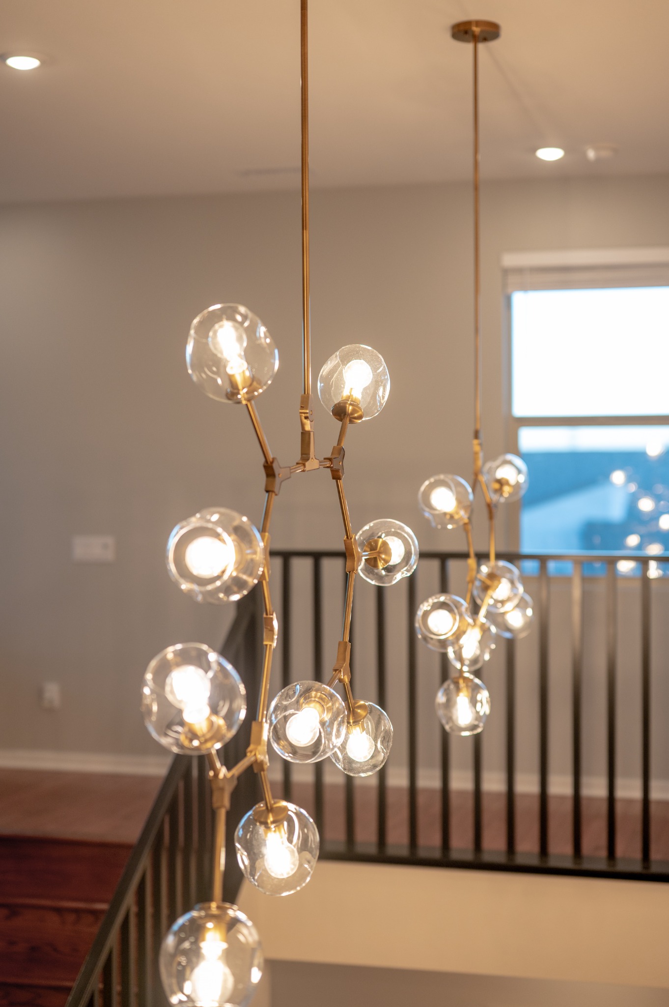 Sculptural lighting above the staircase